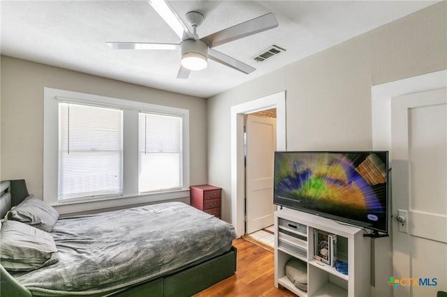 bedroom featuring ceiling fan and wood-type flooring