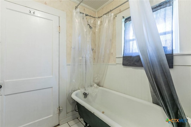 bathroom featuring tile patterned floors, crown molding, and shower / bathtub combination with curtain