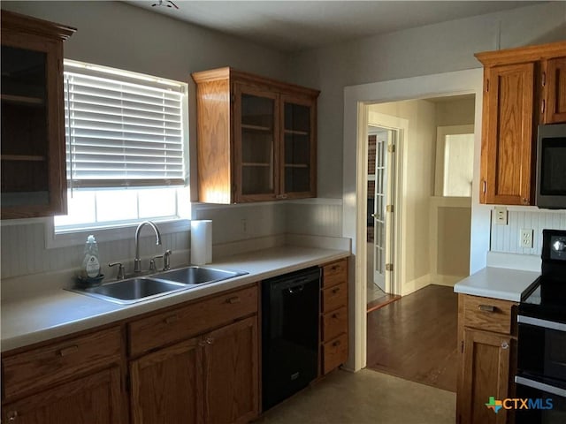 kitchen featuring sink and black appliances