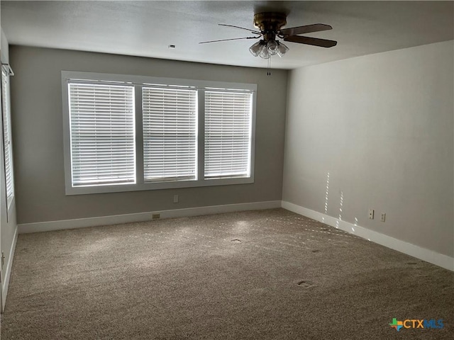 carpeted empty room with ceiling fan