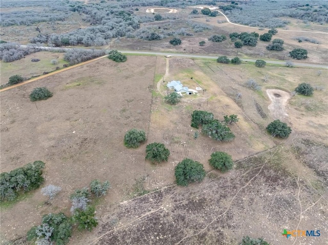 birds eye view of property with a rural view