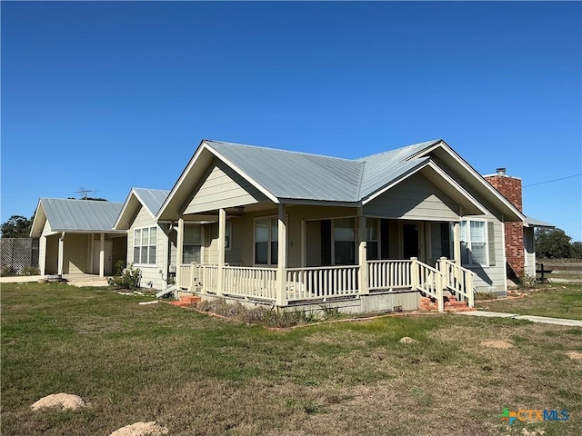 view of front of home featuring a porch and a front yard