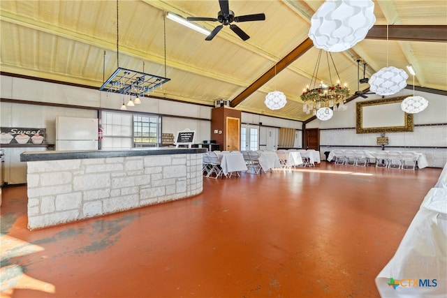 miscellaneous room with concrete flooring, beam ceiling, ceiling fan, and high vaulted ceiling