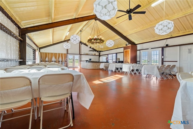 dining area featuring ceiling fan with notable chandelier, a healthy amount of sunlight, and wood ceiling