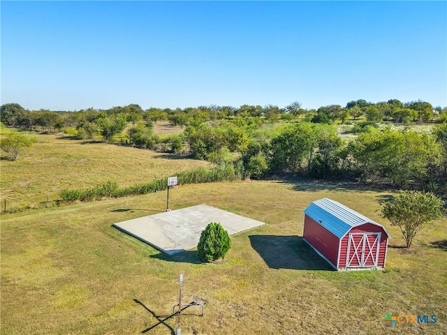 exterior space featuring a shed and a rural view