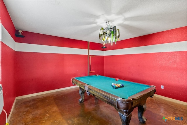 playroom featuring concrete floors, billiards, and a textured ceiling