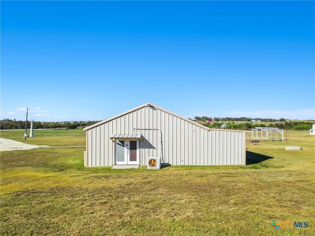 view of outdoor structure with a yard