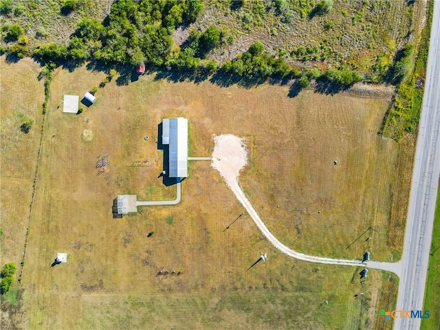 birds eye view of property featuring a rural view