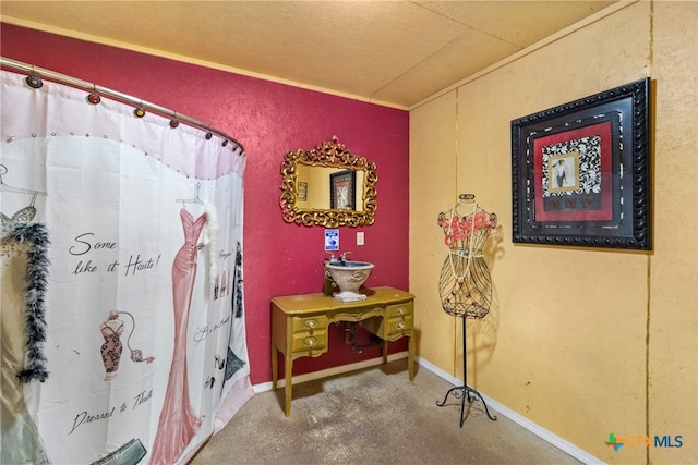 interior space featuring a textured ceiling and curtained shower