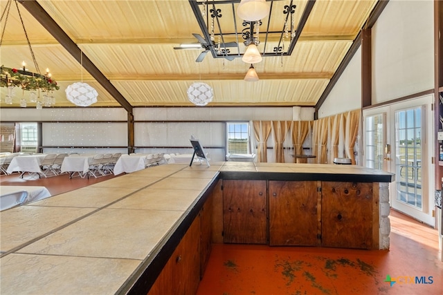 kitchen with vaulted ceiling with beams