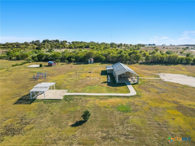 birds eye view of property featuring a rural view