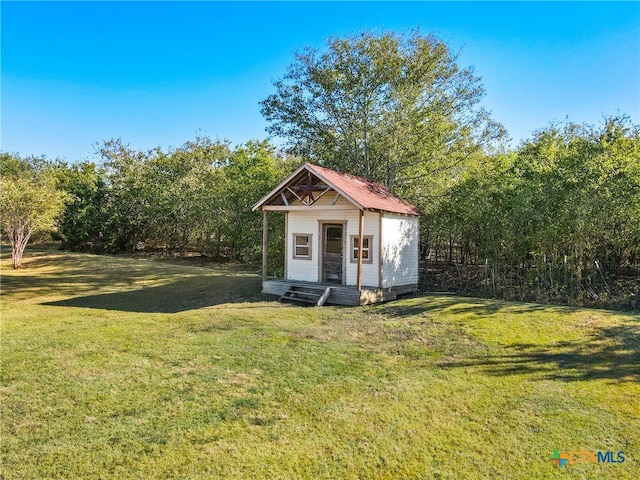 view of outdoor structure with a lawn