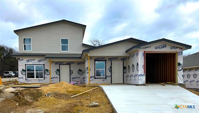 property in mid-construction with a garage