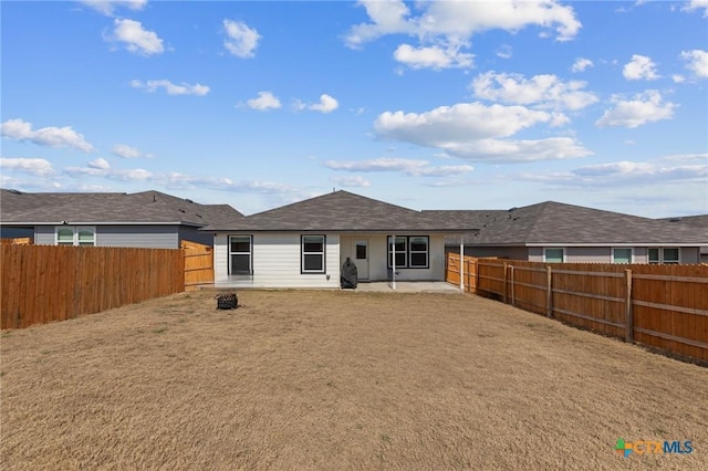 back of property featuring a patio area and a fenced backyard