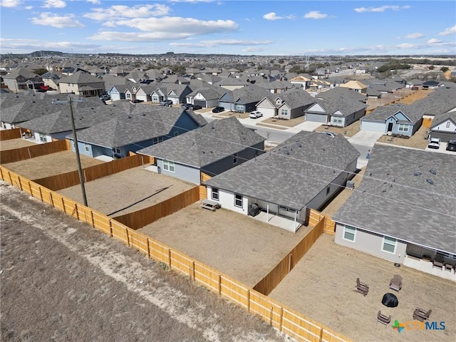 birds eye view of property with a residential view