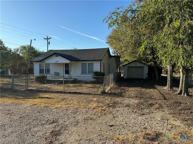 12101 Moffat Rd, Temple, TX 76502 - view of front of home with an outdoor structure, dirt driveway, and a garage