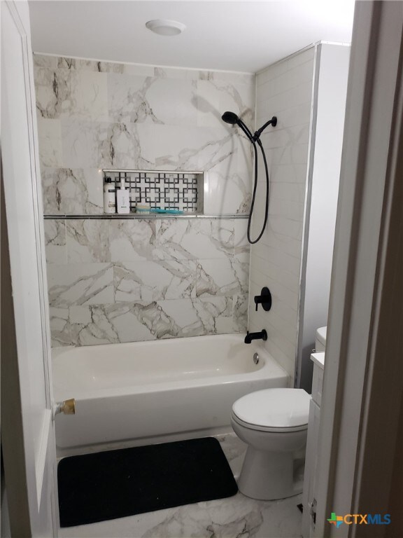 12101 Moffat Rd, Temple, TX 76502 - full bathroom featuring toilet, shower / tub combination, vanity, and marble finish flooring