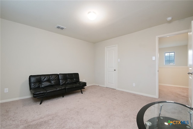 living area featuring light colored carpet