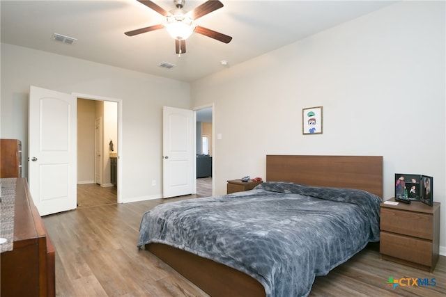 bedroom featuring hardwood / wood-style floors and ceiling fan