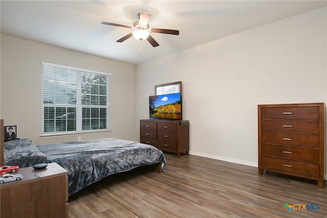 bedroom featuring ceiling fan and dark hardwood / wood-style flooring