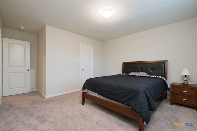 bedroom with light carpet