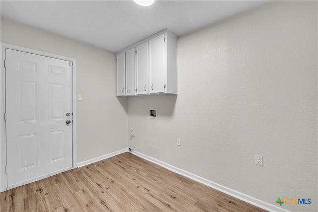 laundry area featuring light hardwood / wood-style flooring, washer hookup, cabinets, and gas dryer hookup