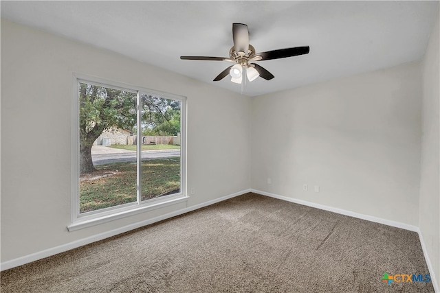 empty room with carpet flooring and ceiling fan