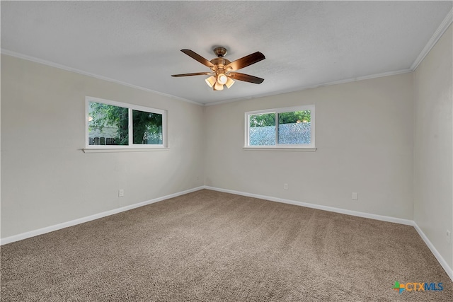 carpeted empty room with ceiling fan, a textured ceiling, and crown molding