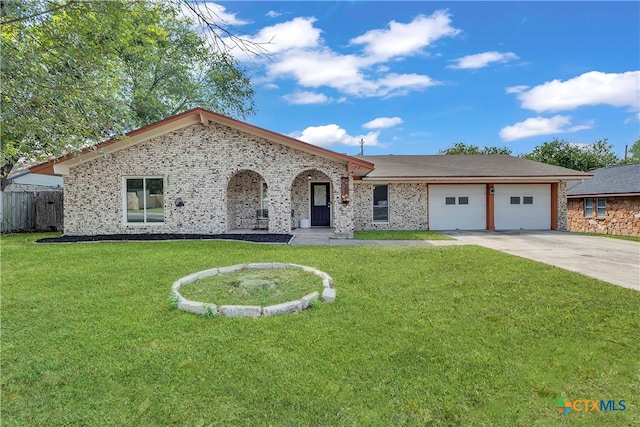 single story home with a garage and a front lawn