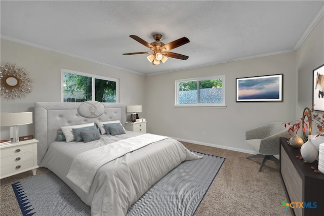 carpeted bedroom with ornamental molding, a textured ceiling, and ceiling fan