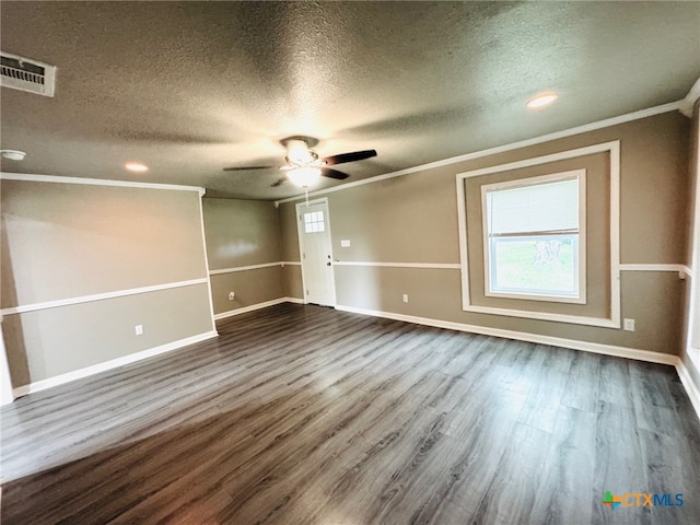 706 Golf Course Rd, Gatesville, TX 76528 - unfurnished room featuring visible vents, ornamental molding, dark wood-style floors, a textured ceiling, and a ceiling fan