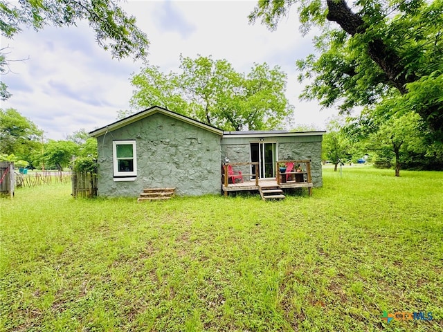 706 Golf Course Rd, Gatesville, TX 76528 - back of property featuring a lawn and a deck