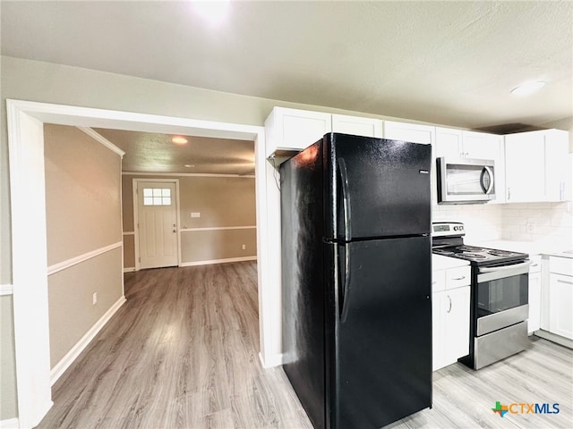 706 Golf Course Rd, Gatesville, TX 76528 - kitchen featuring white cabinetry, appliances with stainless steel finishes, decorative backsplash, and light wood-type flooring