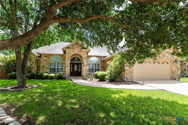 1239 Windy Dawn, Seguin, TX 78155 - view of front of home with stone siding, a garage, a front yard, and driveway