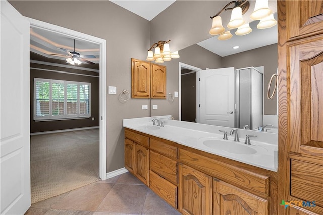 1239 Windy Dawn, Seguin, TX 78155 - full bath featuring double vanity, a chandelier, a ceiling fan, a shower with shower door, and tile patterned floors