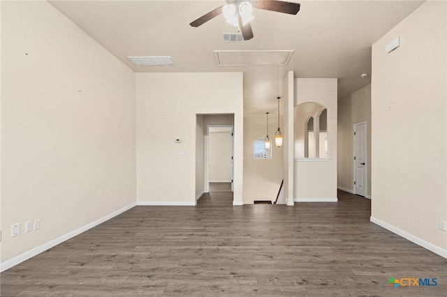 unfurnished room featuring dark hardwood / wood-style flooring and ceiling fan