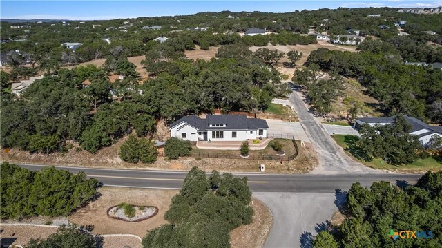 view of front of home featuring a garage and a yard