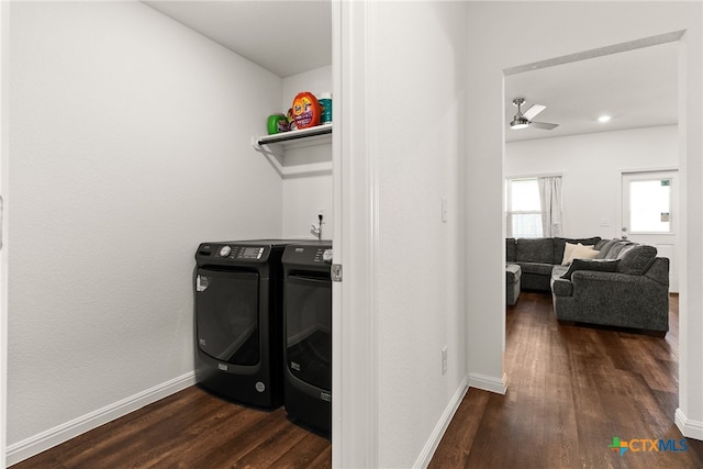 washroom featuring dark hardwood / wood-style flooring, washing machine and dryer, and ceiling fan