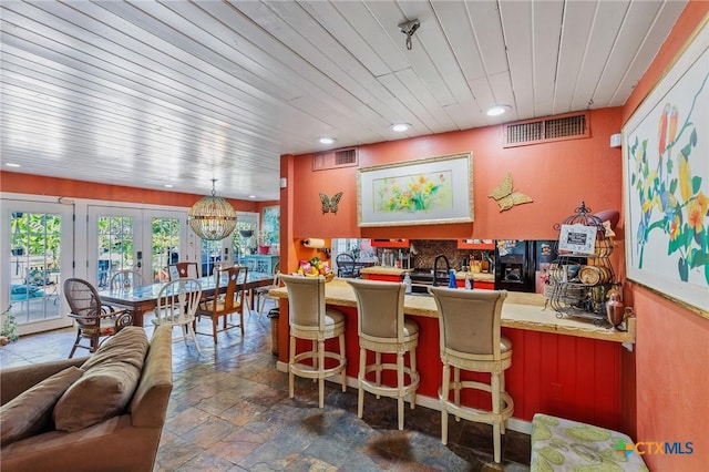 4842 W Fm 2147, Horseshoe Bay, TX 78657 - bar with stone tile flooring, black fridge with ice dispenser, recessed lighting, wooden ceiling, and french doors