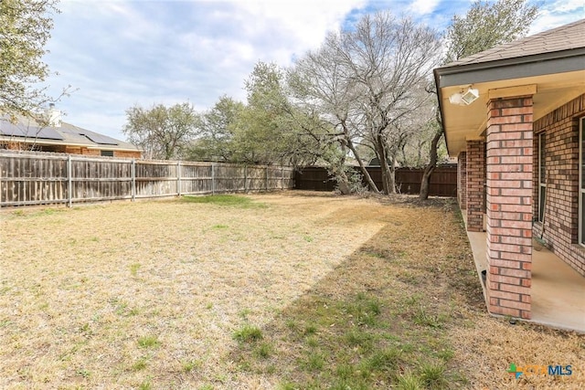 view of yard with a fenced backyard