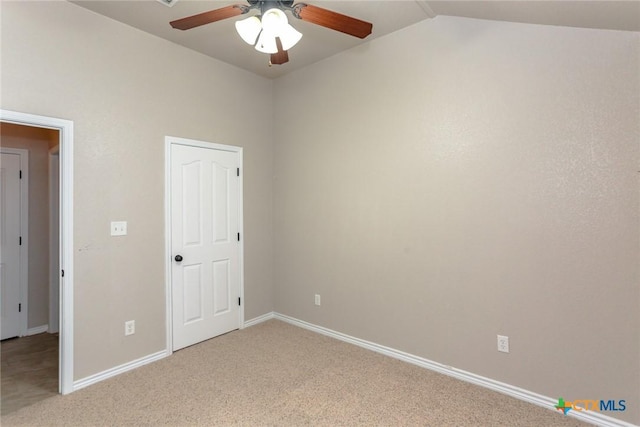 unfurnished bedroom with ceiling fan, baseboards, vaulted ceiling, and light colored carpet