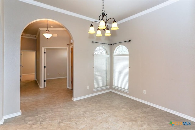 unfurnished room with ornamental molding, arched walkways, and baseboards