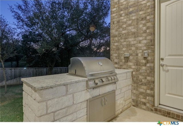 view of patio with exterior kitchen and area for grilling