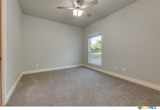 carpeted empty room featuring ceiling fan