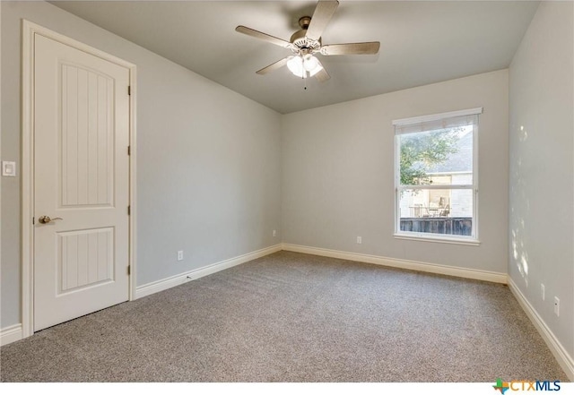 unfurnished room featuring carpet floors and ceiling fan