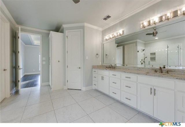 bathroom with vanity, ceiling fan, crown molding, and walk in shower