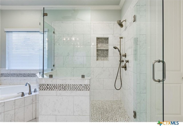 bathroom featuring shower with separate bathtub