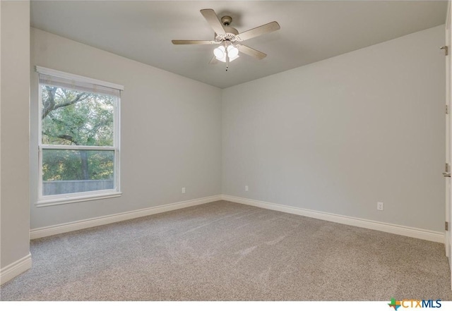 unfurnished room with ceiling fan and light colored carpet