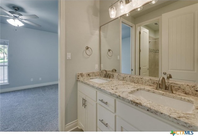 bathroom featuring ceiling fan and vanity