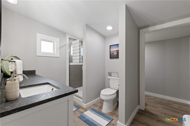 1113 W Port Dr, Port Mansfield, TX 78598 - bathroom with wood finished floors, a stall shower, and vanity